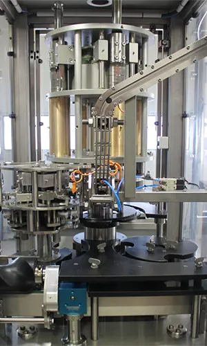 Biduleuse / Capsuleuse mécanique rotative